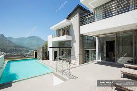 Maybe you would like to learn more about one of these? Modern House And Swimming Pool During Daytime Wealth Building Stock Photo 199383518