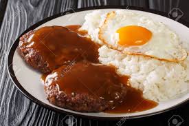 Being an icon of food culture, hamburger has as more theories of its appearance as the planet earth. Classic Hawaiian Dish Loco Moco Consists Of Steamed Rice With Juicy Hamburger Steak Fried Egg And