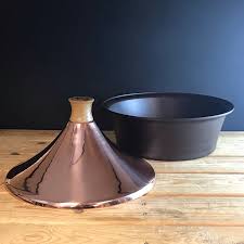 It weighs just under 5kg by itself and around 20kg when loaded with water and a rock. Copper Stove Top Tagine And Spun Iron Bowl