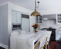 White Marble Waterfall Island With Copper Pendant Transitional Kitchen Marble Kitchen Island Kitchen Design Kitchen Island Design
