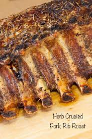 Bacon slices, pork, fresh thyme, pork roast, salt, pepper. Herb Crusted Pork Rib Roast Art And The Kitchen