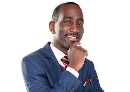 Robert burale wears numerous caps; Photo Of Stylish Pastor Robert Burale Looking Poor As A Church Mouse