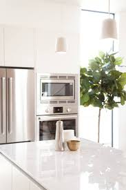 a cooktop and wall oven in the kitchen