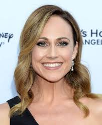 Michelle Kostka is an optimist, striving to make the world a better place.  When her sister needs help, she's up for the challenge—in the quirkiest way  possible! Italia Ricci and Michael Xavier