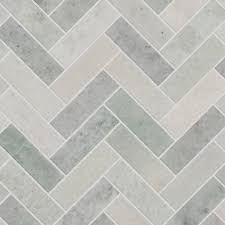 Design of rectangular tiles mounted on spikes. Verbena Honed Marble Herringbone Mosaic Tiles Mandarin Stone