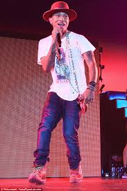 Image result for Pharrell Williams brings sick fan onstage at Philadelphia concert