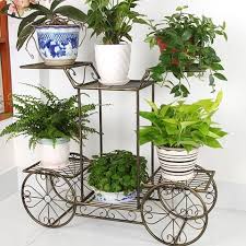 Picture Of Apartment Garden With Wrought Iron Stand Flower Stands Wrought Iron Plant Stands House Plants Decor