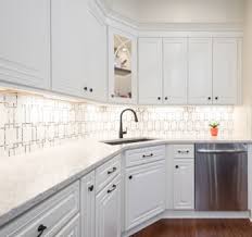 Though this kitchen's range and cabinets are both white, one has brass. Backsplash Ideas For White Cabinets 5 Gorgeous Tips