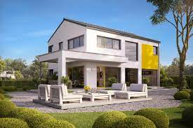 A patio with garden views is offered in each unit. Vitalis 155 Puristisches Fertighaus