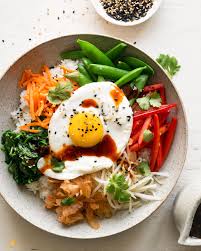 Bibimbap With Snap Peas Carrots And Fried Eggs Recipe In 2019 Vegetarian Recipes Meals Home Delivery Meals
