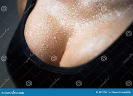 Closeup Portrait of a Female Big Wet Breast. Young Beautiful Girl Shows Her  Gorgeous Breasts. Woman Body. Stock Photo - Image of female, black:  153276716