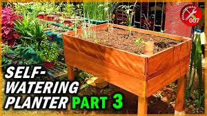In larger containers, an inverted plastic water bottle with the bottom cut out works as a fill tube. How To Make A Wood Planter Box Waterproof Self Watering Raised Planter Box Part 2 Of 3 Youtube