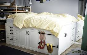 Ikea Hack A Bed Made From Metod Kitchen Cabinets With A Yellow Quilt In A Small Room Diy Platform Bed Ikea Cabinets Bed Ikea Bed