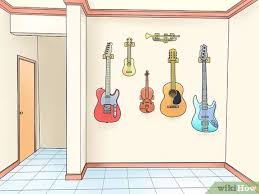 Place the hanger where you want it on the wall make a small pencil mark at the top of the mounting block, and then measure the same distance down the wall. How To Hang Instruments On The Wall 15 Steps With Pictures