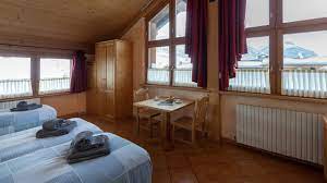 Zimmer ab 161 € pro bett/nacht (je nach saison und auslastung) zum angebot. Appartamenti La Grolla Livigno