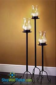 This Beautiful Black 3 Piece Hurricane Candle Lamp Set Will Surely Set The Mood At Your H Hurricane Candle Lamps Floor Candle Holders Tall Floor Candle Holders