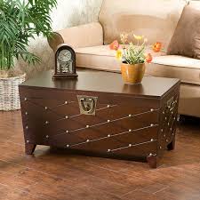 This coffee table features a single drawer and a lower shelf for added storage. Nailhead Trunk Coffee Table