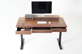 The grovemade desk shelf provides an ergonomic lift and ample space for up to two screens. Woolsey Smart Desk Sean Woolsey Studio