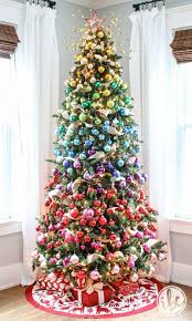 More ornaments, figurines, artists & decor. How To Style The Ultimate Gradient Rainbow Christmas Tree