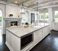 White wave granite from brazil is a dark white background with patterns of large whirls that give the overall impression of waves ebbing on the beach. Taupe White Granite Countertops In Kitchen C D Granite Minneapolis Mn
