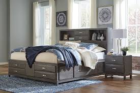 Complete your bedroom with nightstands and bedside tables that offer a convenient perch for a lamp, alarm clock and reading material. Caitbrook Queen Storage Bed With 8 Drawers Ashley Furniture Homestore