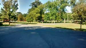 Cars for sale stock lot row. The Browning Building Parking Lot With Park In Background Picture Of Pinecliff Park Frederick Tripadvisor