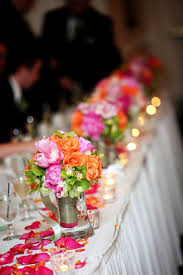 A romantic garden wedding reception head table with a pink and gold color scheme. Pin By Florunique Event Flowers On Colorful Wedding Flowers Wedding Reception Head Table Head Table Wedding Colorful Wedding Flowers