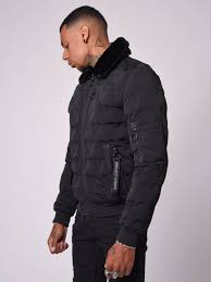 Blouson aviateur matelassé bleu marine, veste sans manches en laine marron, chemise à manches longues écossaise verte, pantalon chino. Veste Matelassee Col Aviateur Fourrure Noire Kayak Officiel