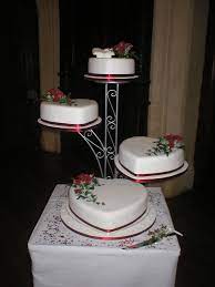 Four Tier Heart Shaped Wedding Cake Decorated With Handmade Sprays Of Roses Rose Le Wedding Cake Stands Heart Shaped Wedding Cakes Wedding Cakes With Cupcakes
