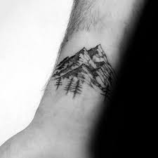 Top 47 Minimalist Mountain Tattoo Ideas 2020 Inspiration Guide In 2020 Wrist Tattoos For Guys Forest Tattoos Simple Tattoos For Guys