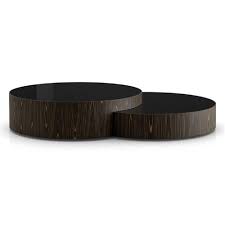 To contrast, they are topped in a matching painted glass, which accentuates a lighter feel even in an impressive piece such as this. Modloft Berkeley Modern Classic Black Glass Top Wood Round Nesting Coffee Table 61 W Over Kathy Kuo Home