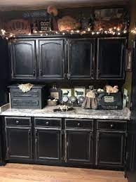 20 Outstanding Halloween Kitchen Cabinets Decor For A Frightening Halloween Primitive Kitchen Cabinets Primitive Kitchen Black Kitchen Cabinets