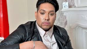 Gay man forced to dress up as a woman