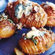 Jazz Up Your Roast Potatoes With Jamie Oliver 39 S Festive Recipe For Hasselbacks With Blue Cheese And Crushed Hazeln Recipes Jamie Oliver Sweet Potato Gratin
