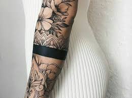 A tattoo is a permanent picture that is drawn on your skin using a motorized needle and ink. Flowers And Armband Tattoo Tattoo Designs For Women