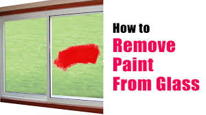 Fill the dish or bucket with warm water and dish soap (enough to make it sudsy), and dip your second cloth into this solution. How To Remove Paint From Glass Youtube