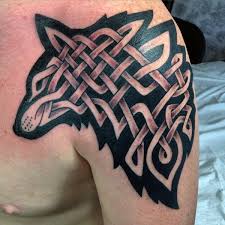 Watercolor tattoo style copies almost exactly this painting technique. Celtic Style Colored Shoulder Tattoo Of Wolf Silhouette Tattooimages Biz