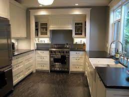 Grey kitchen floor ideas can include concrete effect floor tiles which combine beautifully with a complimentary shade of lighter or darker grey for in order to add depth to a small kitchen use contrasting tones of kitchen cabinets for base and wall cabinets, with darker tones for the lower units. Kitchen With Dark Grey Walls And White Cabinets Instaimage