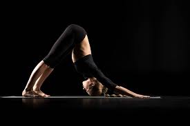 Woman practice yoga downward facing dog or yoga adho mukha svanasana. Woman Performing Adho Mukha Svanasana Or The Downward Facing Dog Pose Isolated On Black Free Stock Photo And Image