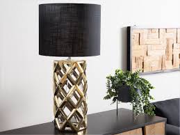 The ideal desk lamp helps you easily see the tasks and projects you're working on without eyestrain ceramic is another material you don't often see used in desk lamps, but there are a few out there. Ceramic Table Lamp Gold With Black Selja Beliani De