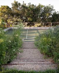 The outdoor fireplace utilizes the board-formed concrete and stone of the  house, with custom steel elements. ⁠ ⁠ Building remodel: Josh Chandler  Designs ⁠ Photos: Marion Brenner⠀⁠ Landscape Installation: Carlos  Landscape, Inc.⁠ ⁠ ⁠ .⁠ .⁠ .⁠ .⁠ #