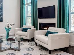 The chandelier, arches, and ornaments offer traditional glamour. White And Turquoise Living Room Novocom Top
