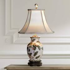 Pairs vintage chinese ginger jars with colourful artisan lamp shades to create contemporary historically used in china to export exotic spices to the west, the humble ginger jar has evolved when combined, our ginger jar table lamps are as unique as the rooms they light up. Leaf And Vine Porcelain Ginger Jar Vase Table Lamp G7001 Lamps Plus