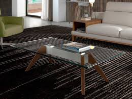 A variety of glass top coffee tables and dining tables are available in the market. Coffee Table With Tempered Glass Tabletop Angel Cerda S L