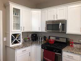 A powerful kitchen paint color combination of burnt orange and light powder blue makes this kitchen a standout. What Color Should I Paint My Kitchen Cabinets Textbook Painting