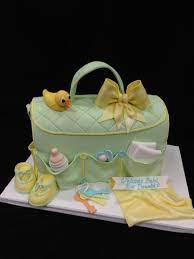 A Diaper Bag Cake With All Items Made From Fondant And The Watchful Duck Baby Shower Desserts Baby Shower Cakes For Boys Baby Shower Cakes
