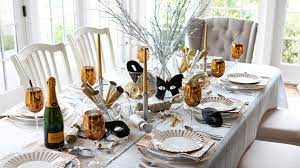 Dining table prepared for christmas dinner, with a christmas tree and kitchen background, close up shot moving around the table. 10 Tips For A Beautiful And Inviting Dining Table Set Up Home Design Lover