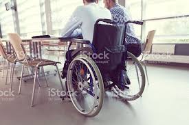 Disabled Businessman Sitting In A Wheelchair At The Conference Table Business Man Disability Stock Images Free