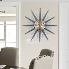 This starburst has clear acrylic tips that catch light and create a unique display. Starburst Wall Clock Modern Decorative Personalized Blue Gold Metal
