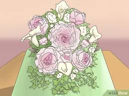 Wrap your ribbon around the top of the floral bouquet holder, beginning at the top. How To Arrange A Cascade Bridal Bouquet 13 Steps With Pictures